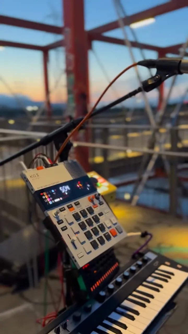 Drum machine, keyboard and microphone on the orange bridge