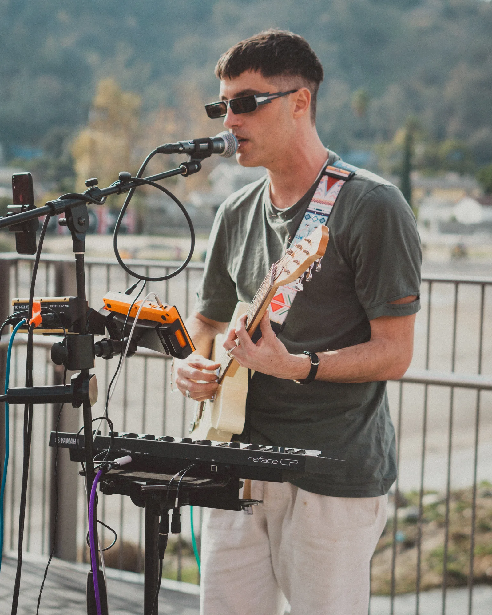 Magmatic singing and playing guitar on the orange bridge